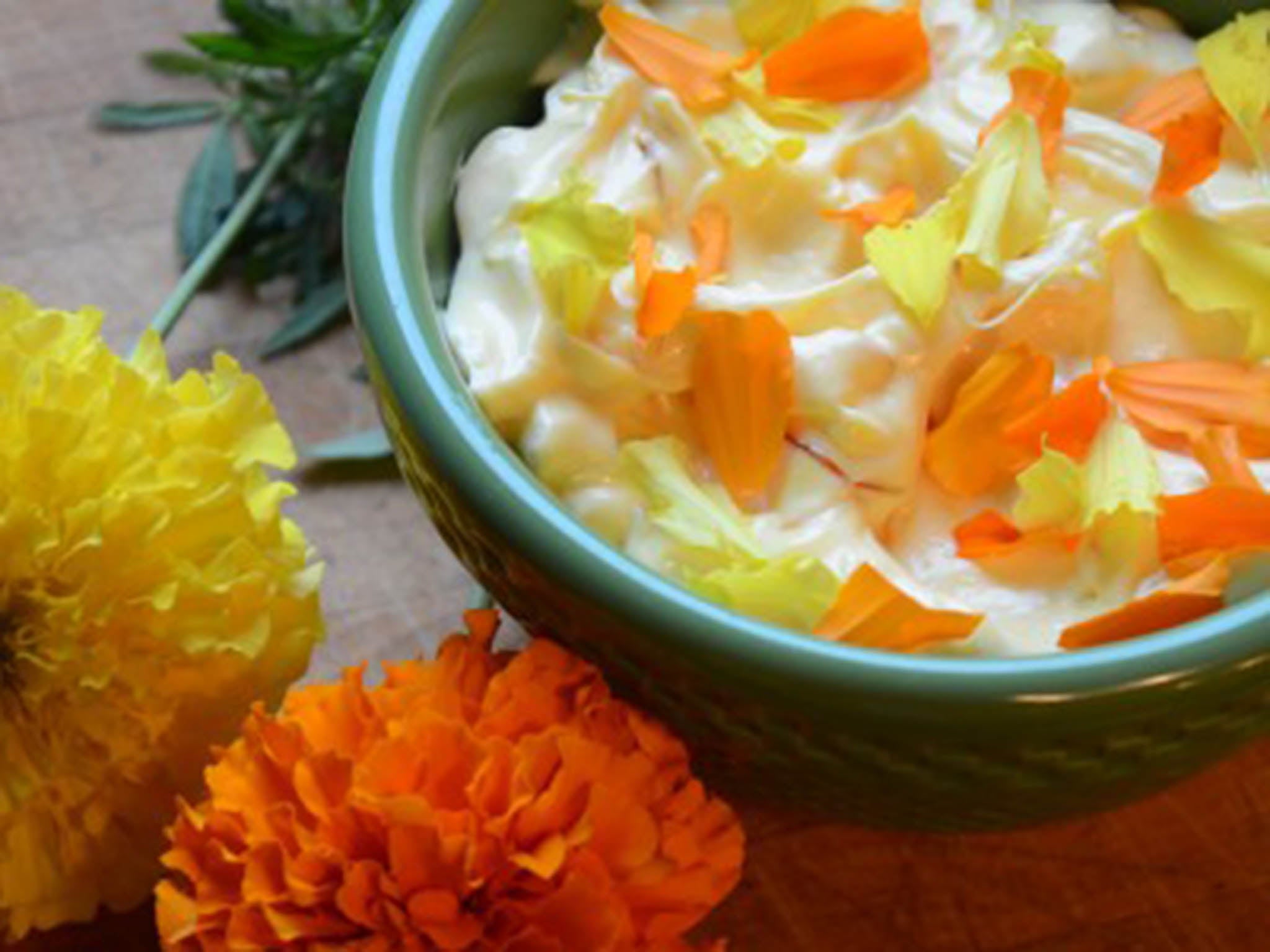 Flowers add flavour, texture and beauty to a dish. Orange marigold petals were mixed into this homemade saffron aioli