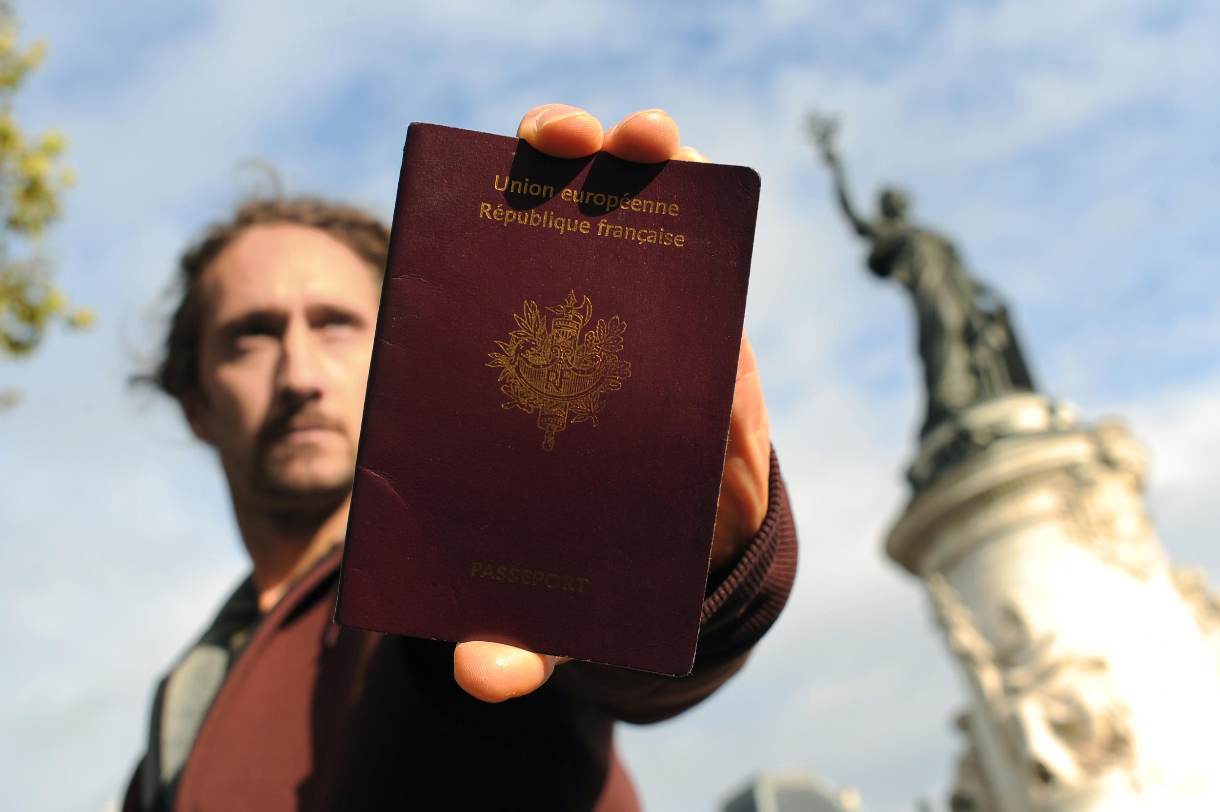 French citizens could soon be allowed to smile for their passport photos