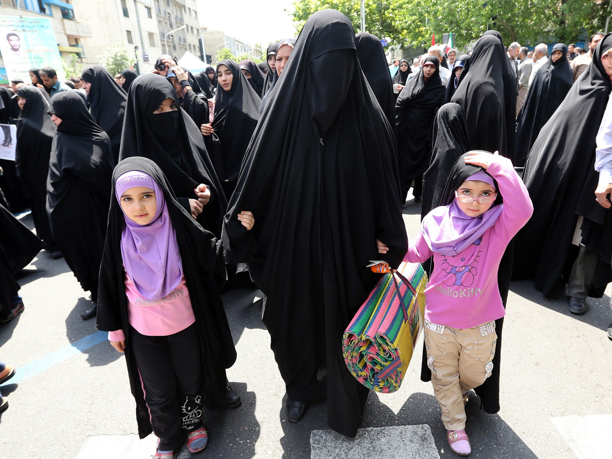 Iranian hardliners calling for the government to enforce rules governing women's dress in Tehran in 2014