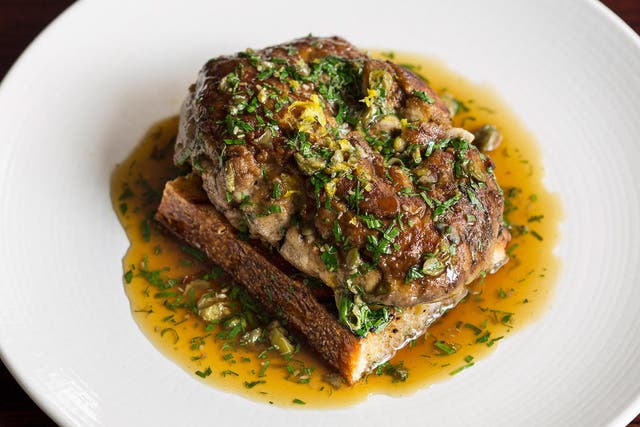 The brains were presented on a square of toast and drizzled with a capery meunière sauce