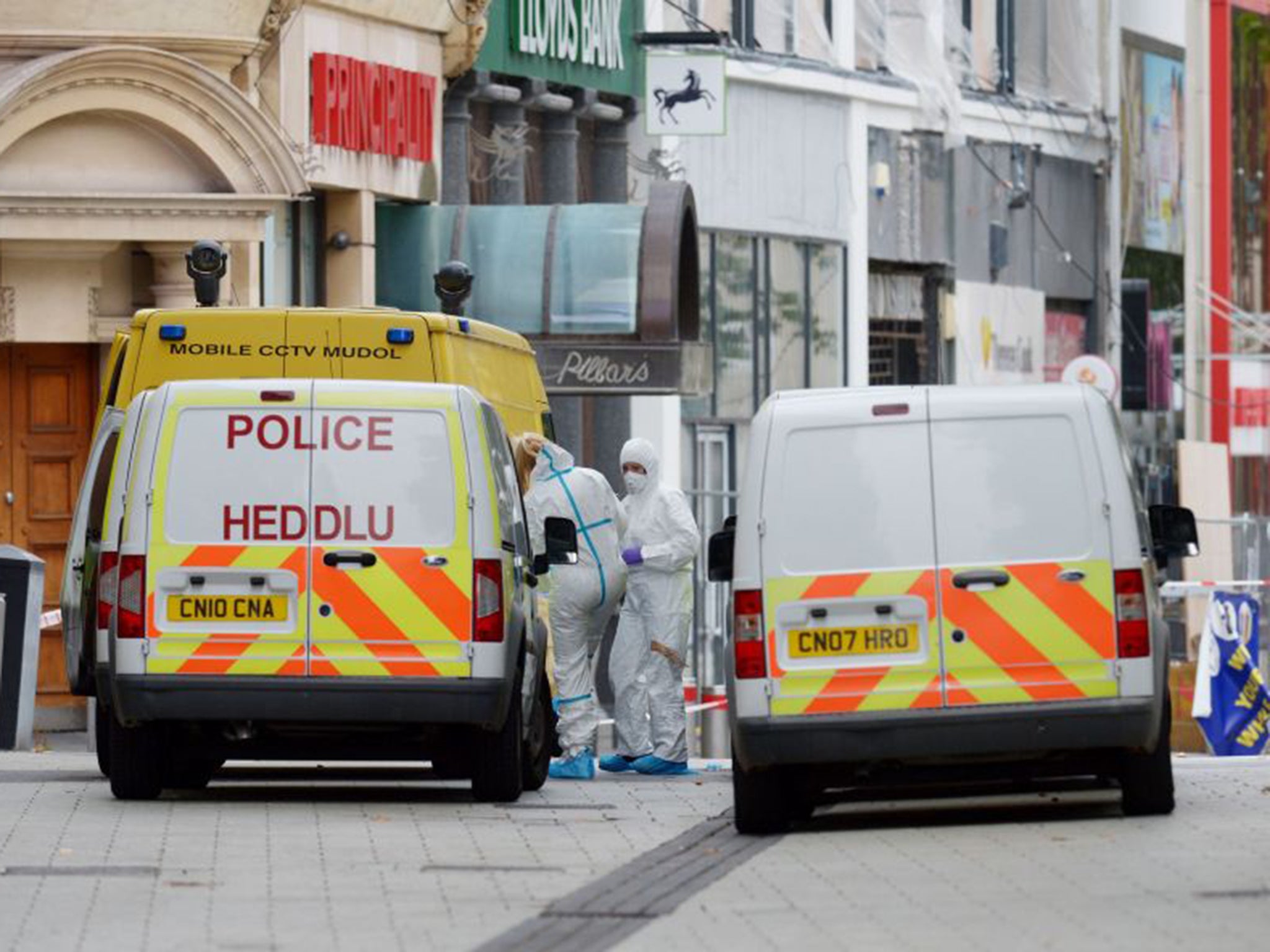 Forensic officers at the scene in Queen Street, near Cardiff Castle after the bodies of Miss Morgan and Mr Simmons?were found in Cardiff city centre
