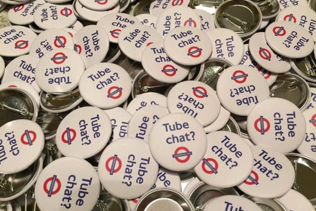 People were given badges that encourage strangers to talk to each other on the London Underground