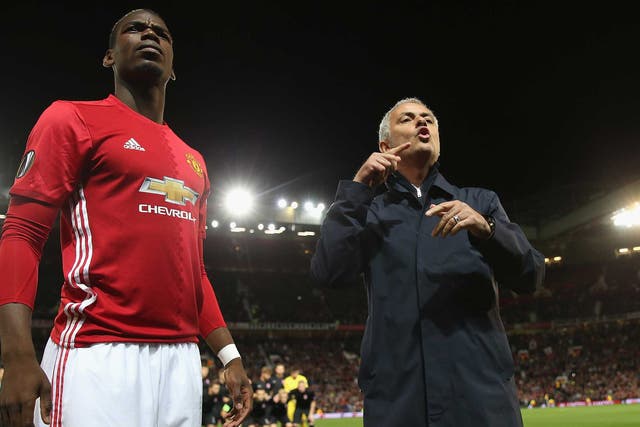Jose Mourinho barks at his coaching staff as Paul Pogba watches on