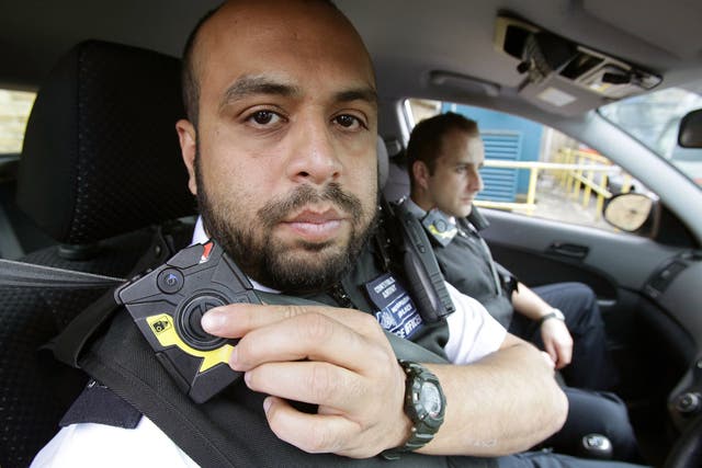 A Met Police officer switches on his camera during a previous trial of the technology in 2014