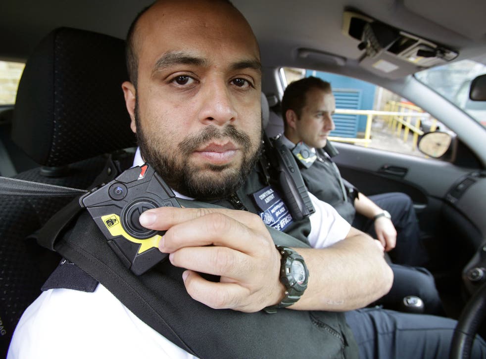 A Met Police officer switches on his camera during a previous trial of the technology in 2014