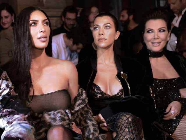 <p>Kim in Paris with her mother and sister shortly before the robbery </p>