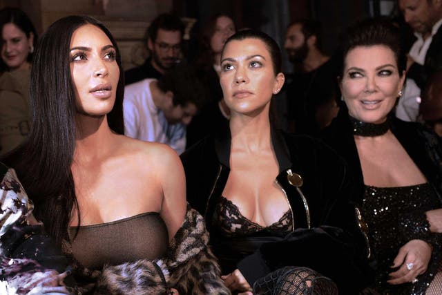<p>Kim in Paris with her mother and sister shortly before the robbery </p>