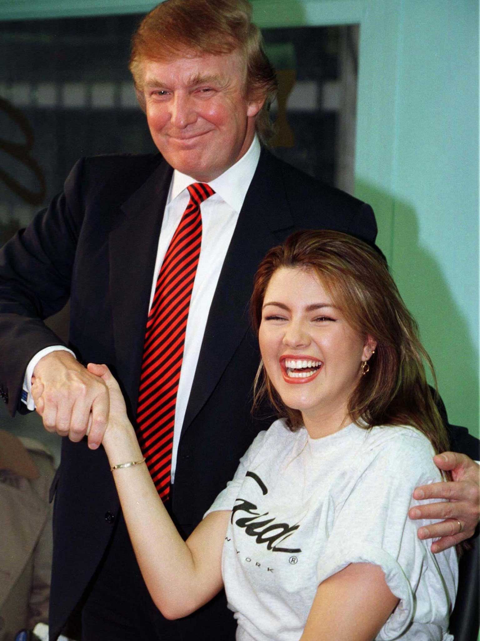 Machado with Trump during a staged workout at a gym in New York in 1997