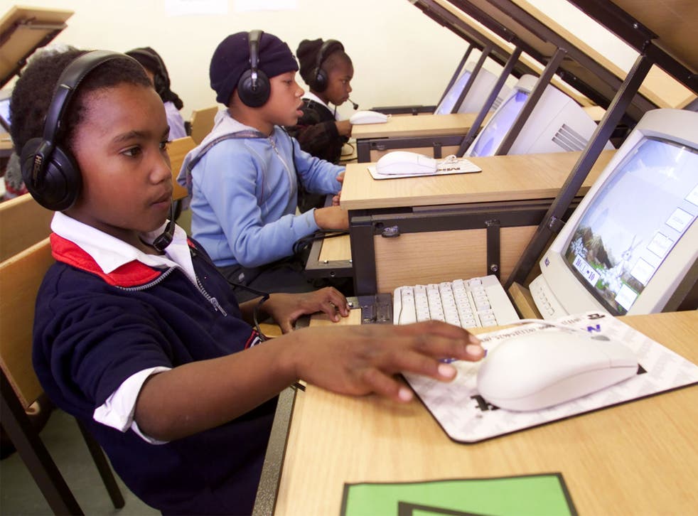 Pupils at a township school in Cape Town get to grips with computers for the first time as part of a project funded by the Dutch government