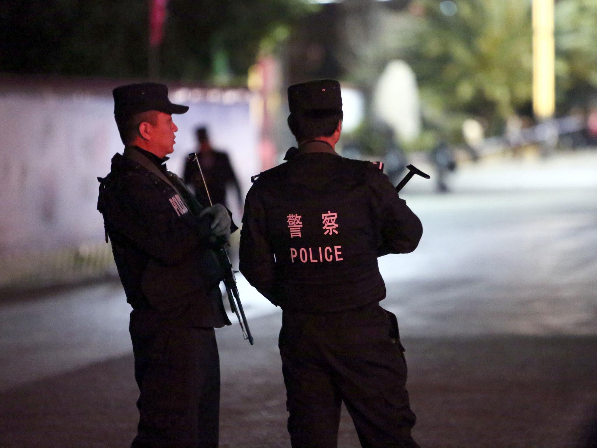 Police in Kunming, where Yang Qingpei was arrested