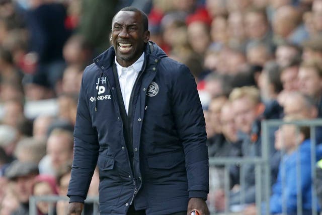 Jimmy Floyd Hasselbaink watches on during Queens Park Rangers' win against Fulham