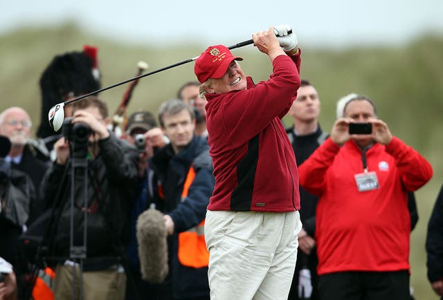 <p>Donald Trump teeing off at one of his golf courses </p>