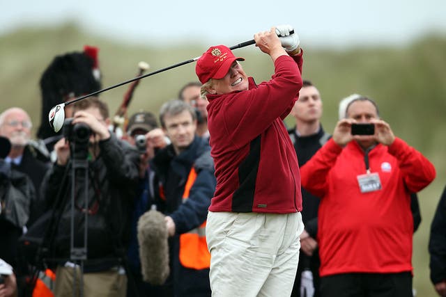 <p>Donald Trump teeing off at one of his golf courses </p>