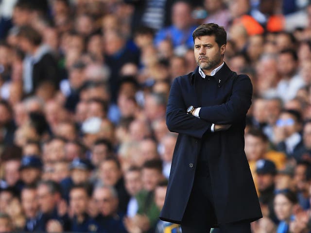 Mauricio Pochettino looks on from the sideline during his team's 2-0 win against City