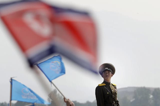 A North Korean military soldier stands guard on Sept. 24 during an air festival in Wonsan, North Korea