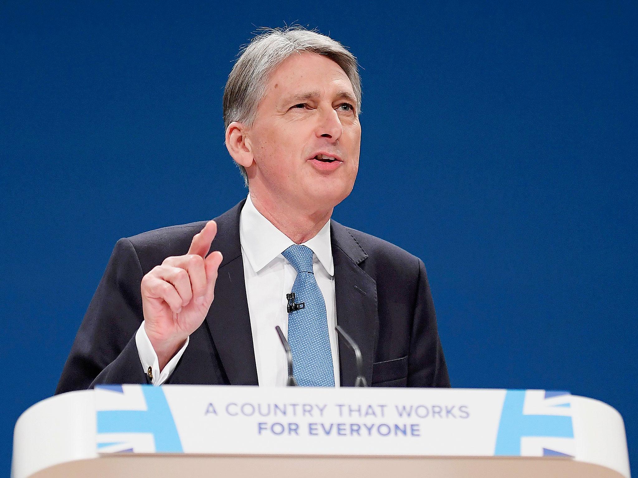 Britain's Chancellor of the Exchequer Philip Hammond speaks at the Conservative Party conference in Birmingham, England.