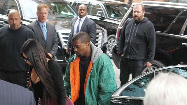 Kim Kardashian West and her husband Kanye arrive back at their town house in New York City last night