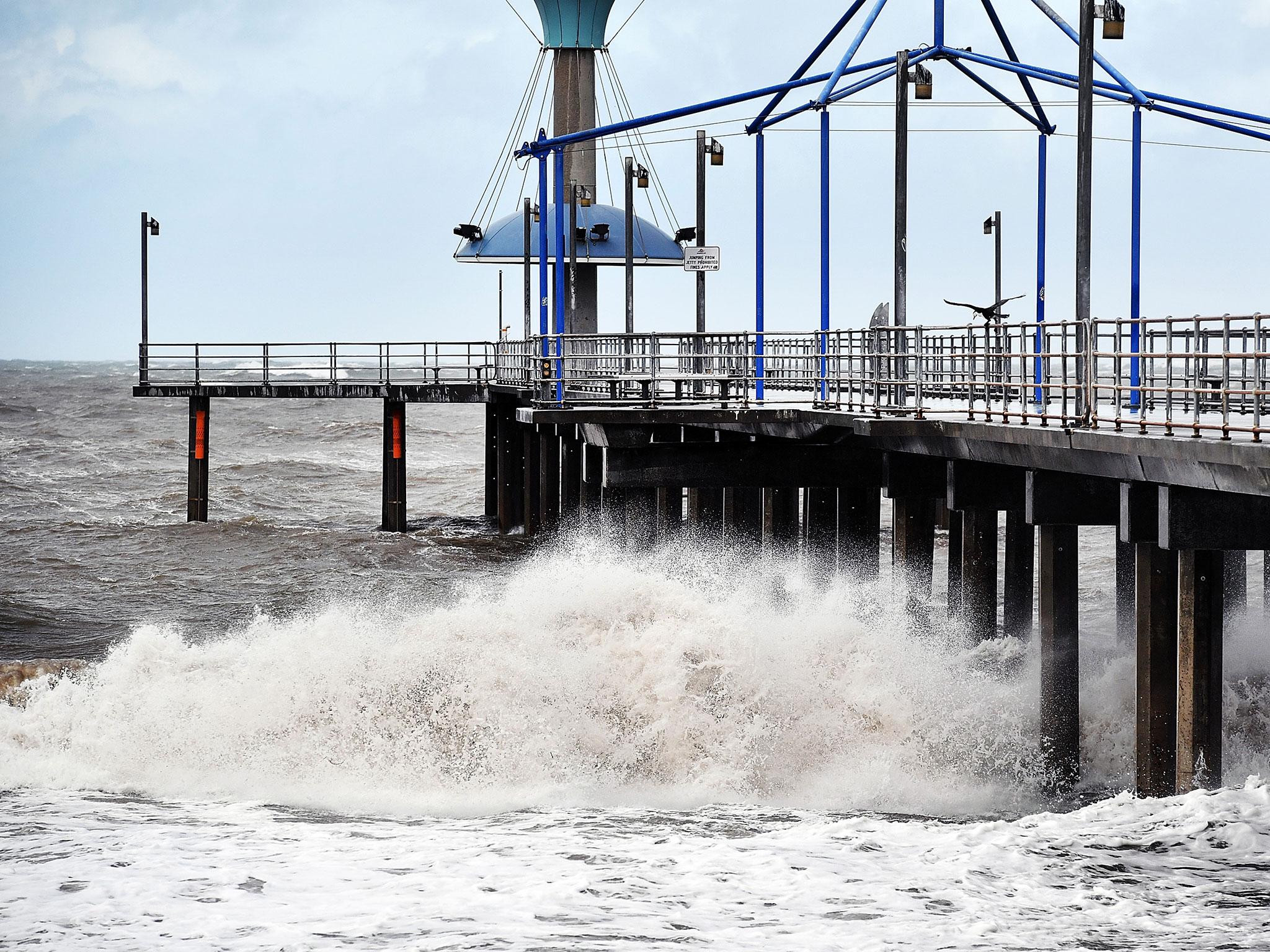Waves crash into the Brighton Jetty on September 29 in Adelaide, Australia. South Australia was plunged into darkness overnight, as the state suffered a complete blackout, following a severe storm.