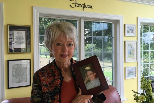 Terri Roberts holds a photo of her son, Charles Carl Roberts, who shot and killed Amish girls in their schoolhouse 10 years ago (Colby Itkowitz/The Washington Post)