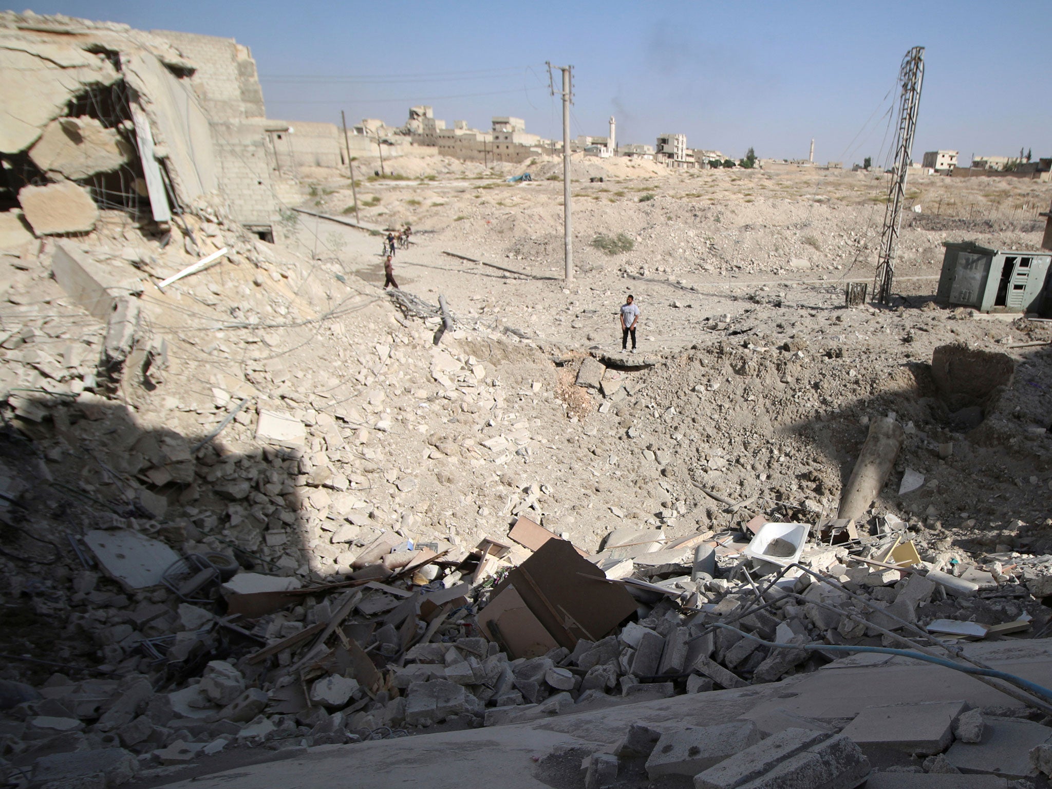 The crater left after an air strike in the rebel held Karam Houmid neighbourhood in Aleppo