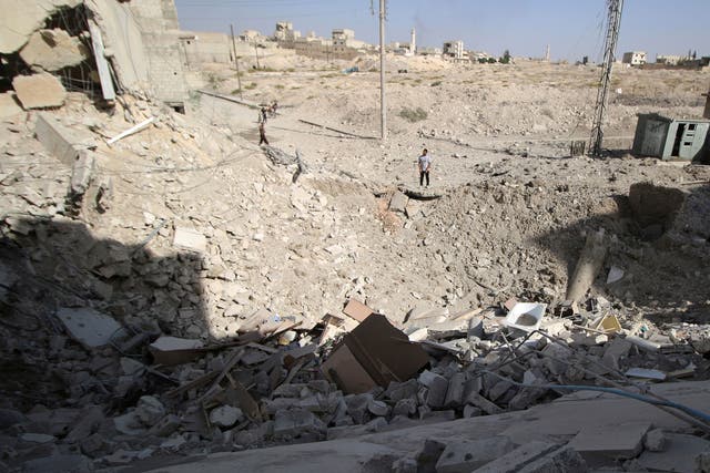 The crater left after an air strike in the rebel held Karam Houmid neighbourhood in Aleppo