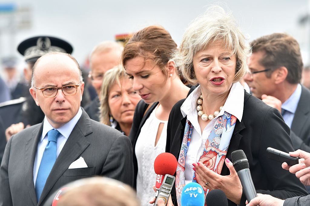French Interior Minister Bernard Cazeneuve (left) and Theresa May pictured last year at a photocall about joint policing