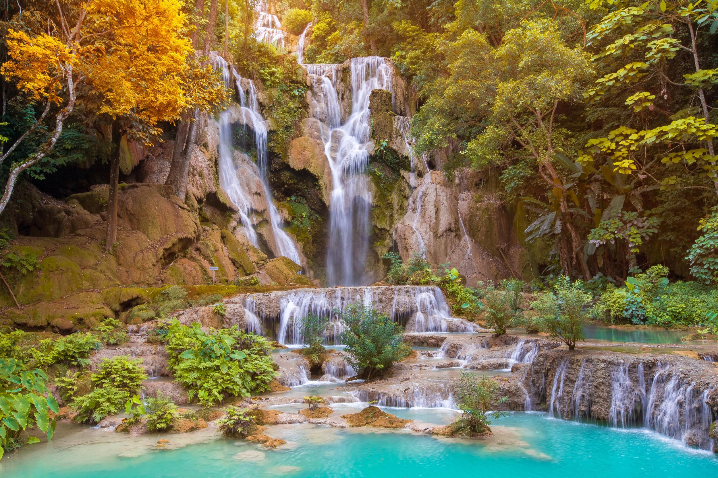 The multi-tiered Kuang Si Falls make a great day trip