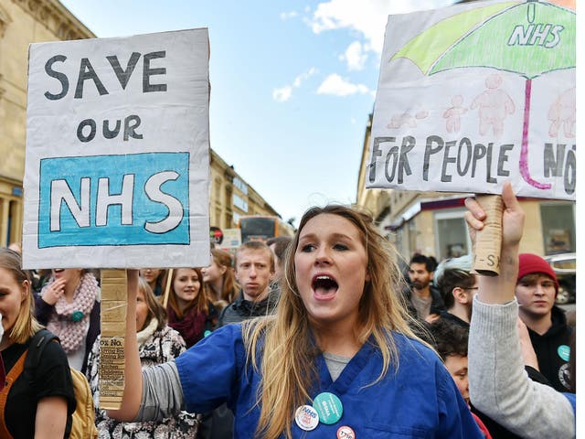 Junior doctors and supporters rally through the city centre during an all-out strike on April 26, 2016 in Bristol, England