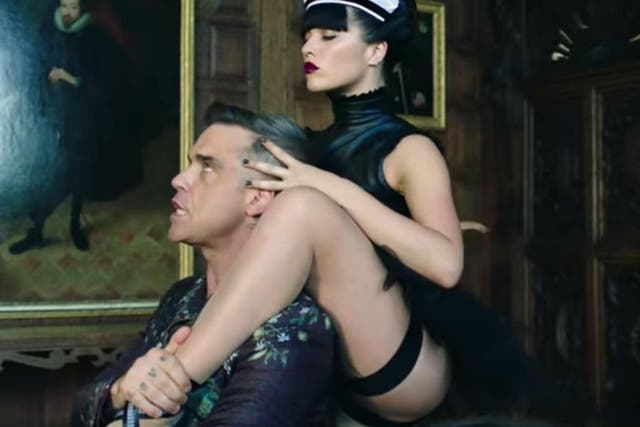 Robbie Williams dances with Russian maids in his new video for 'Party Like a Russian'