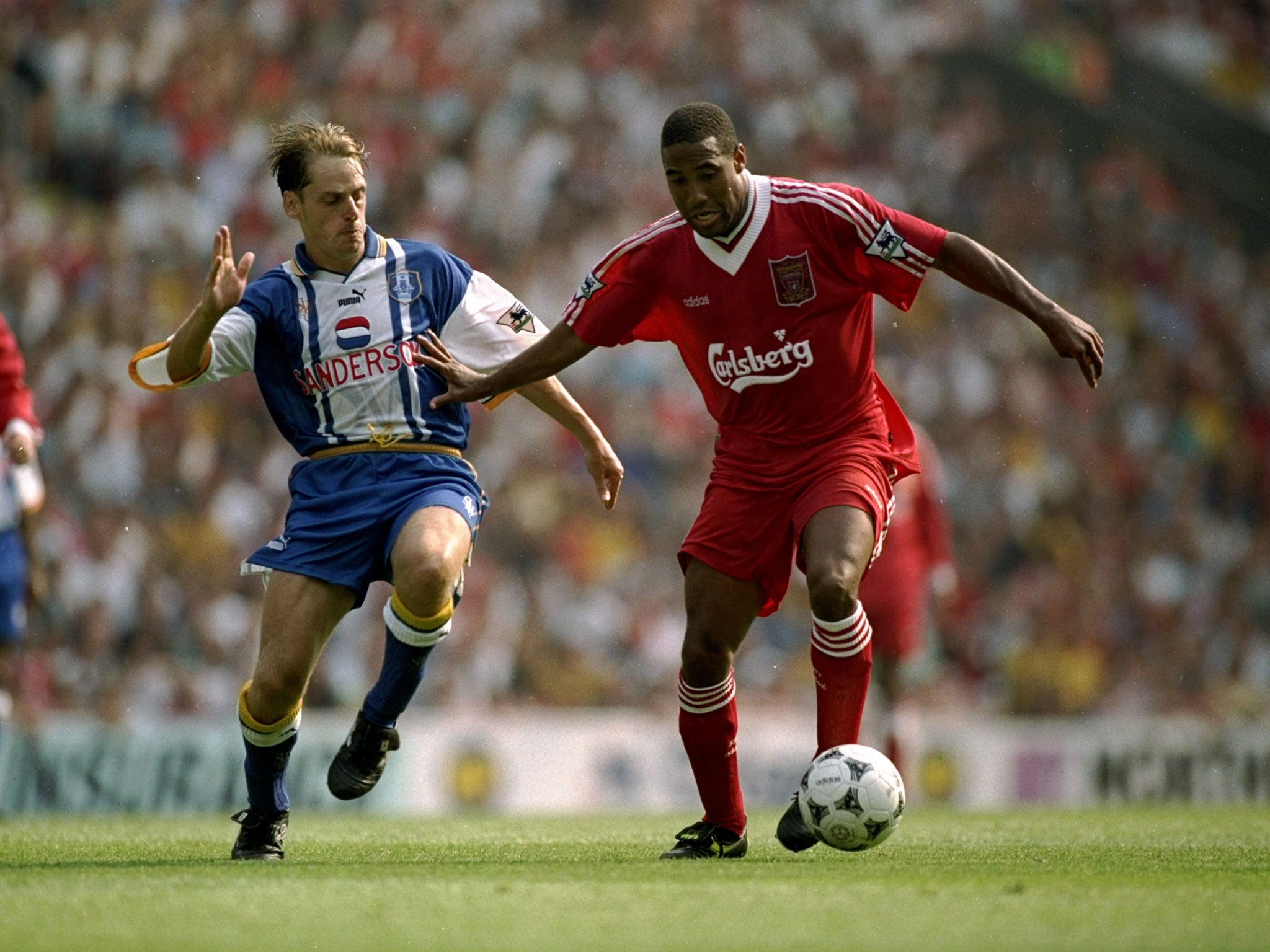 John Barnes takes on Graham Hyde of Sheffield Wednesday during the FA Carling Premiership match against Sheffield Wednesday played at Anfield, August 1995.