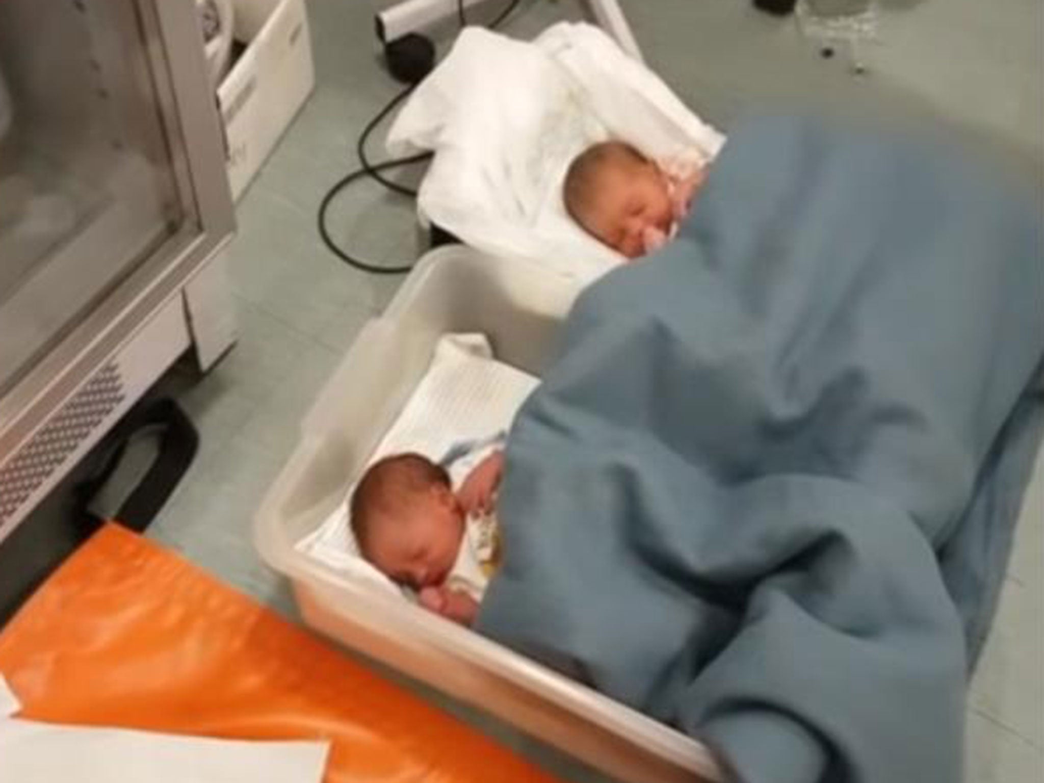 Two of the newborn babies rescued from a refugee boat on 3 October