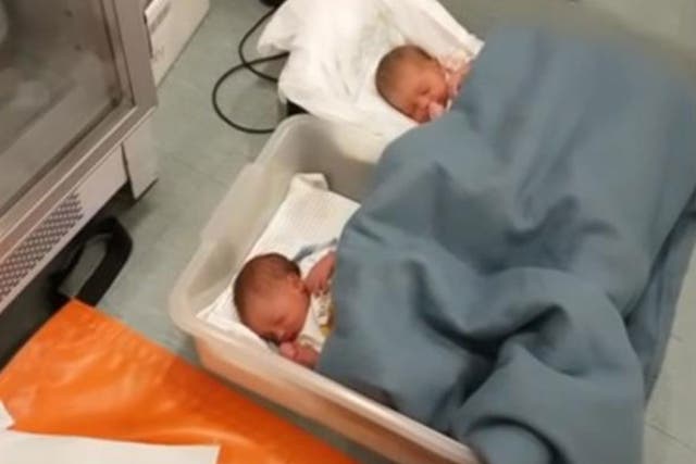 Two of the newborn babies rescued from a refugee boat on 3 October