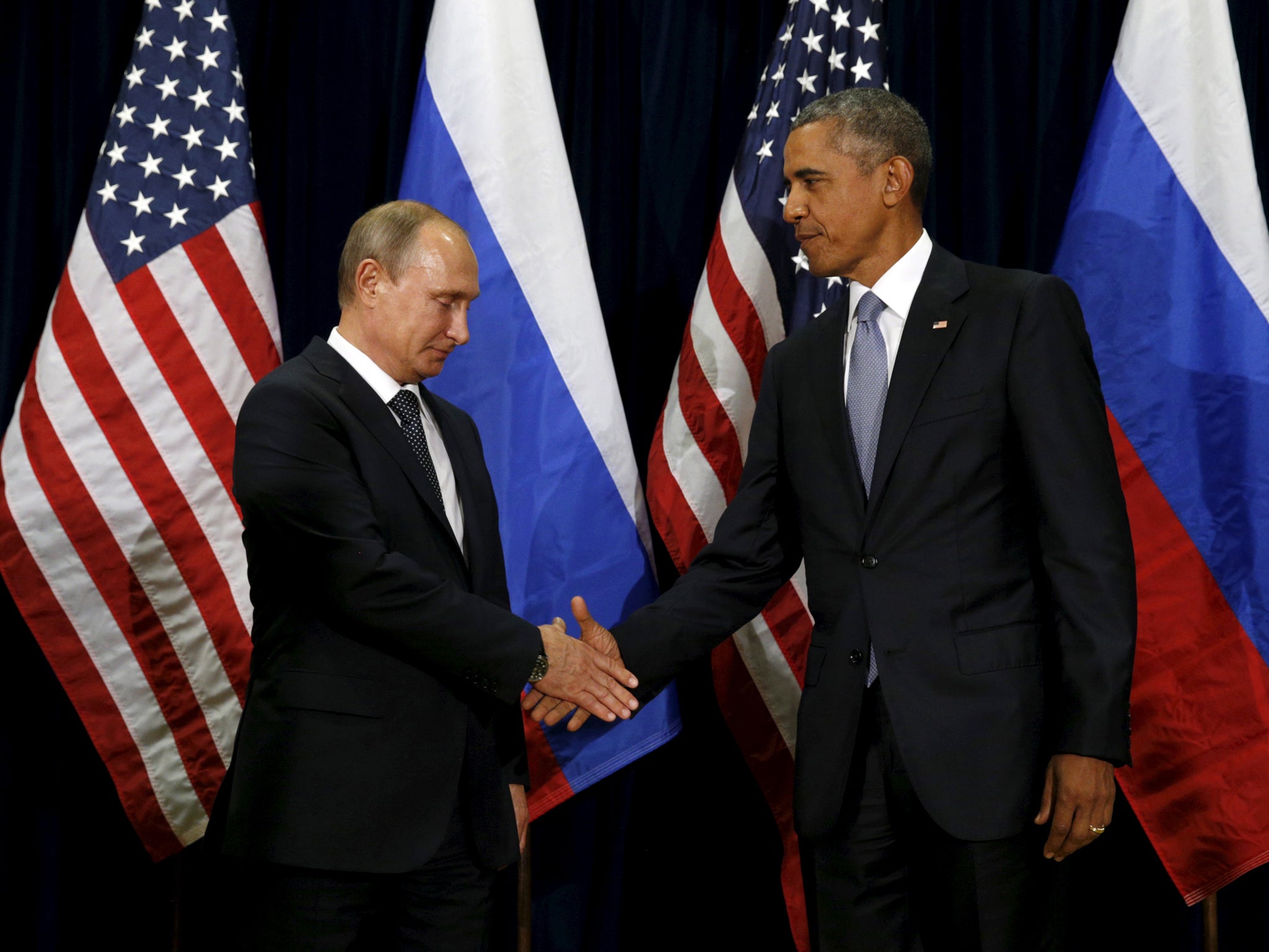 US President Barack Obama shakes hands with Russian President Vladimir Putin in happier times