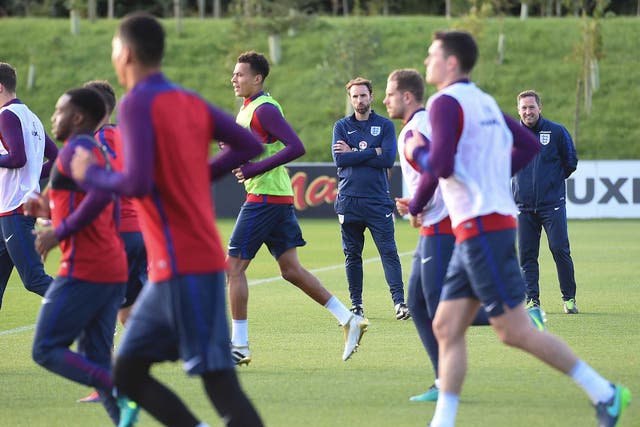 Gareth Southgate watches over the England squad during training