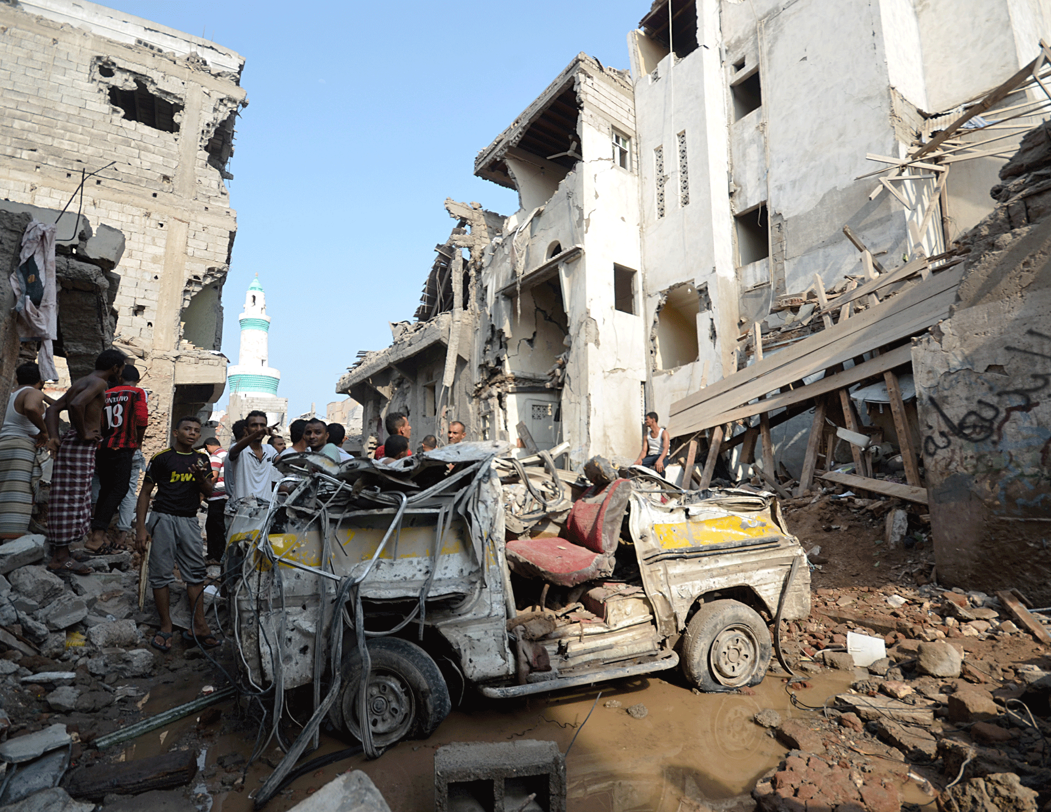 People gather at the site of a Saudi-led air strike in the Red Sea port city of Hodeidah - 22 September 2016