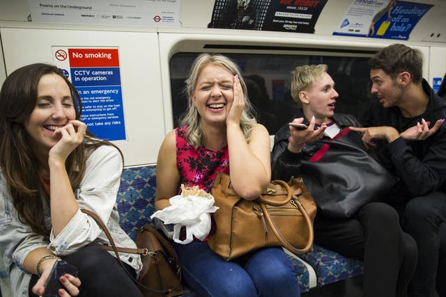 Passengers sit on board the Night Tube along the Victoria line on August 20, 2016 in London, England.