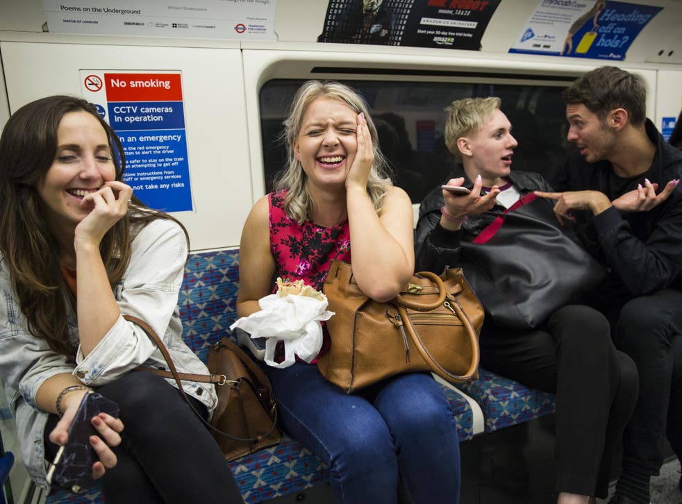 Passengers sit on board the Night Tube along the Victoria line on August 20, 2016 in London, England.
