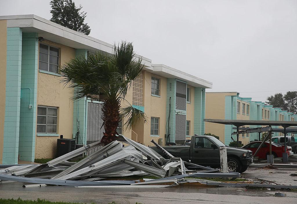 COCOA BEACH, FL - OCTOBER 07: Metal is wrapped around a palm tree due to the heavy winds of Hurricane Matthew, October 7, 2016 on Cocoa Beach, Florida. Hurricane Matthew passed by offshore as a catagory 3 hurricane bringing heavy winds and minor flooding.  (Photo by Mark Wilson/Getty Images)