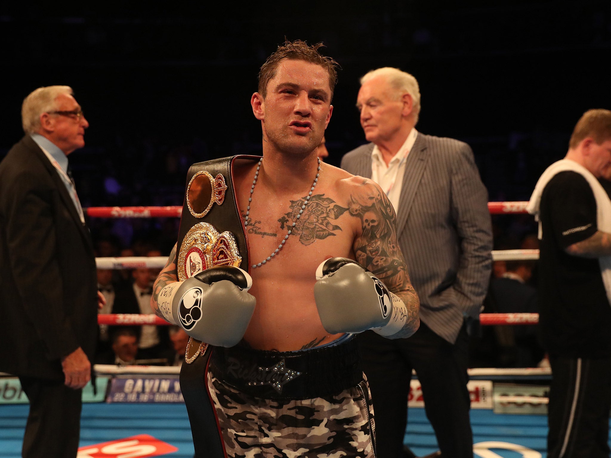 Ricky Burns celebrates after retaining the WBA super lightweight championship