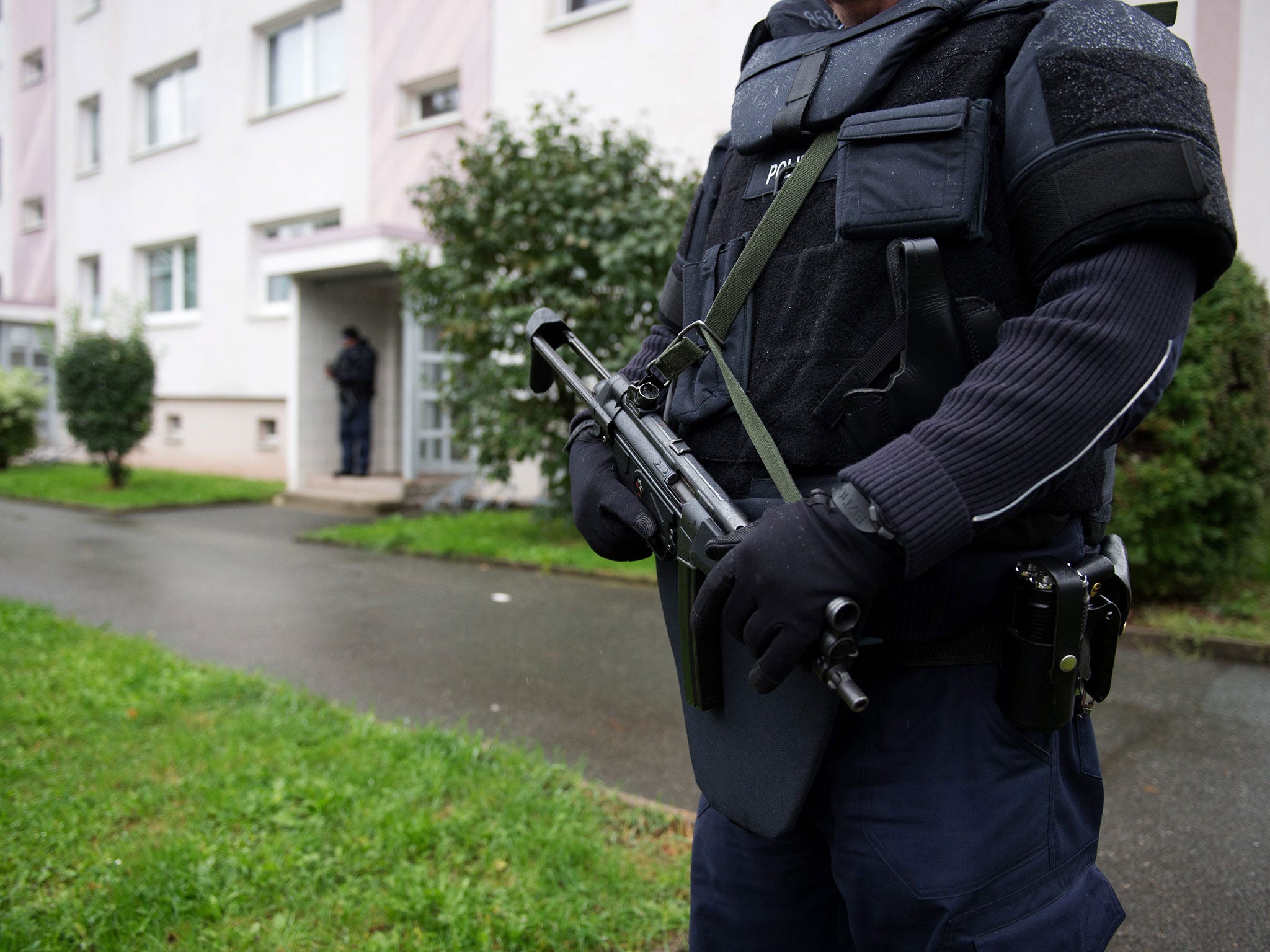 Police officers secure a residential area in Chemnitz, Germany, on 8 October