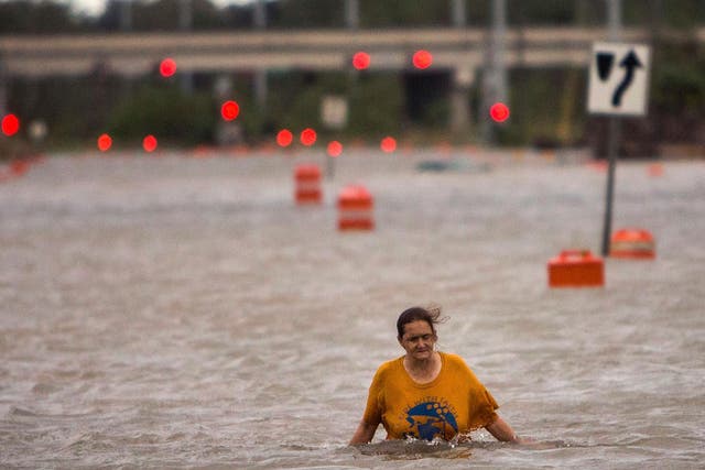 A woman wades through water as Georgia experiences massive flooding from Hurrican Matthew <em>AP</em>