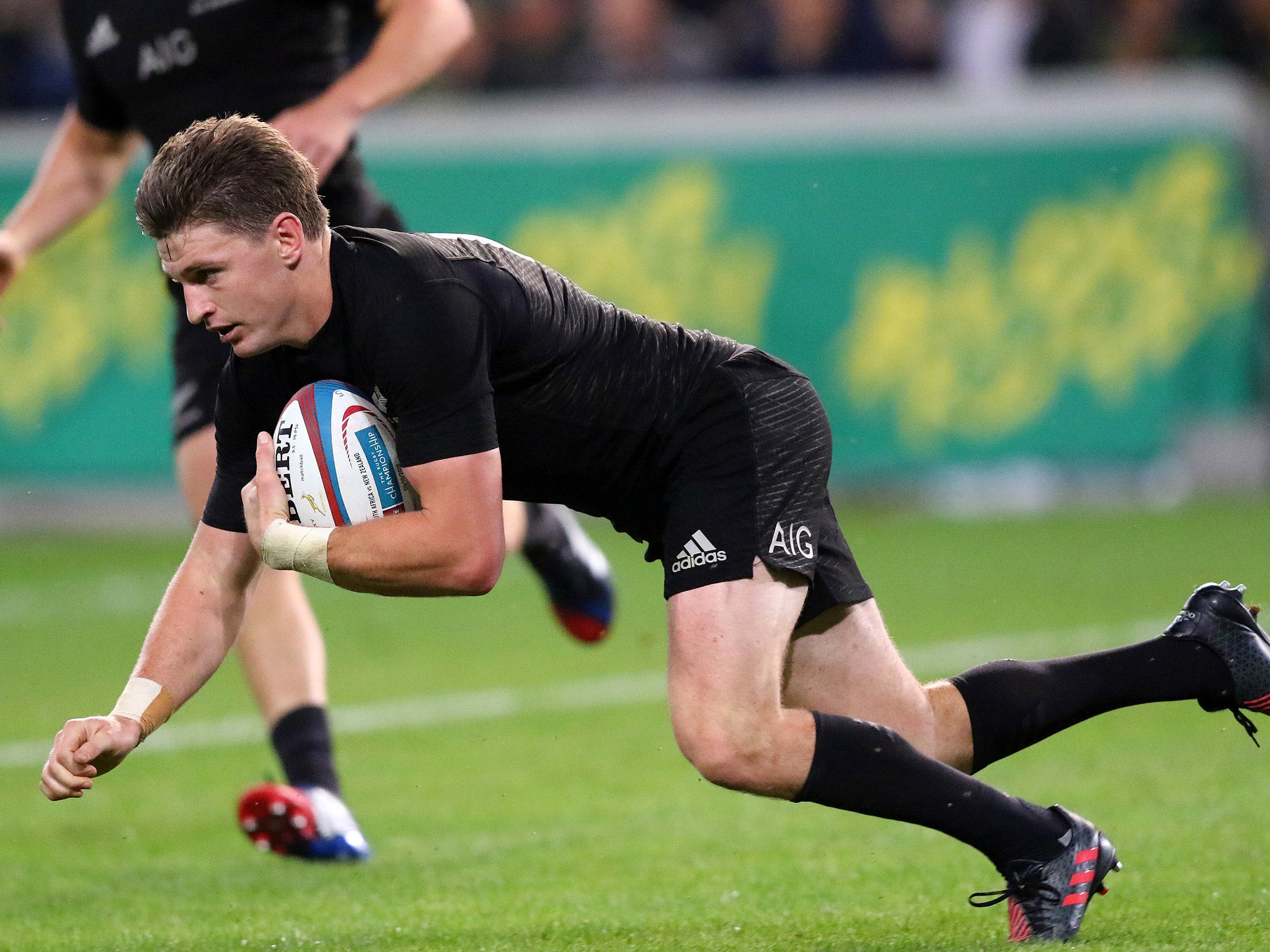 Beuden Barrett scores one of New Zealand's nine tries against South Africa