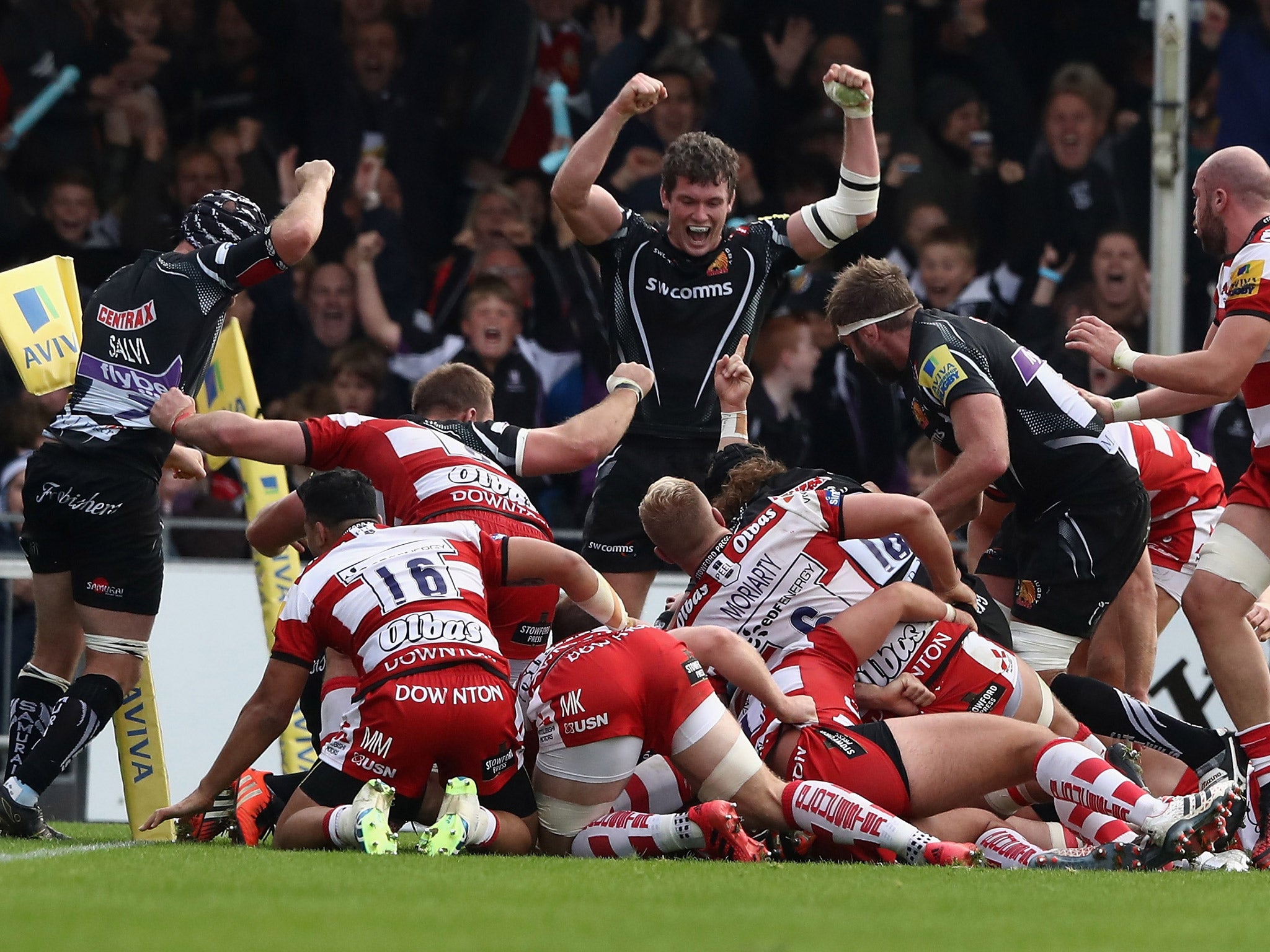 Exeter players celebrate after Damian Welch scores a try