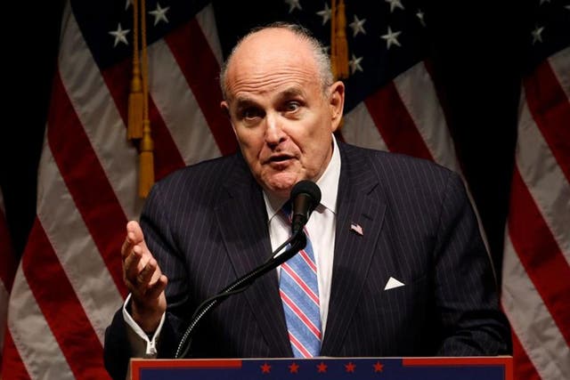  Former New York Mayor Rudy Giuliani speaking at a Donald Trump rally in Iowa in September