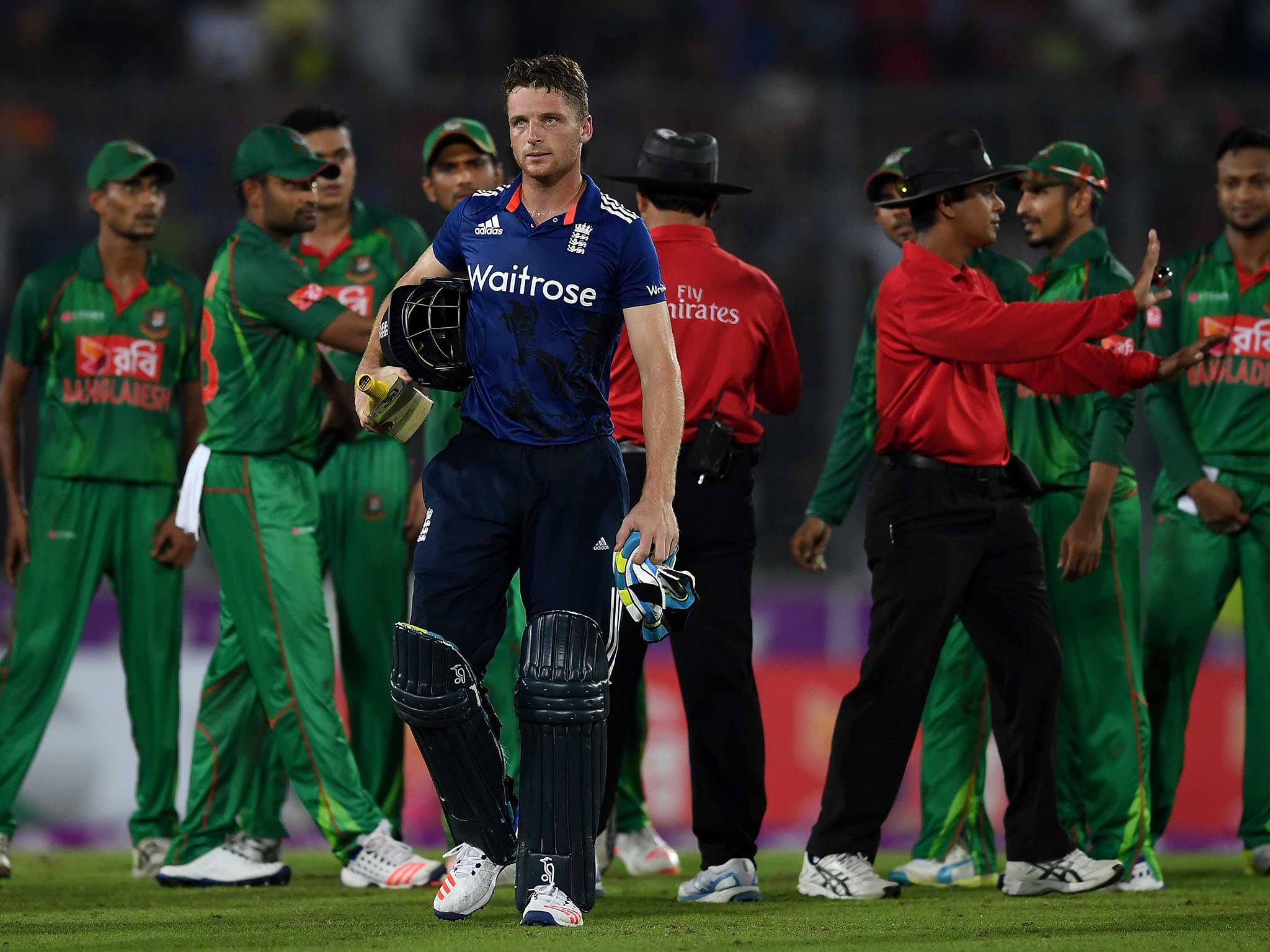 Jos Buttler leaves the field as the hosts are separated by the umpires