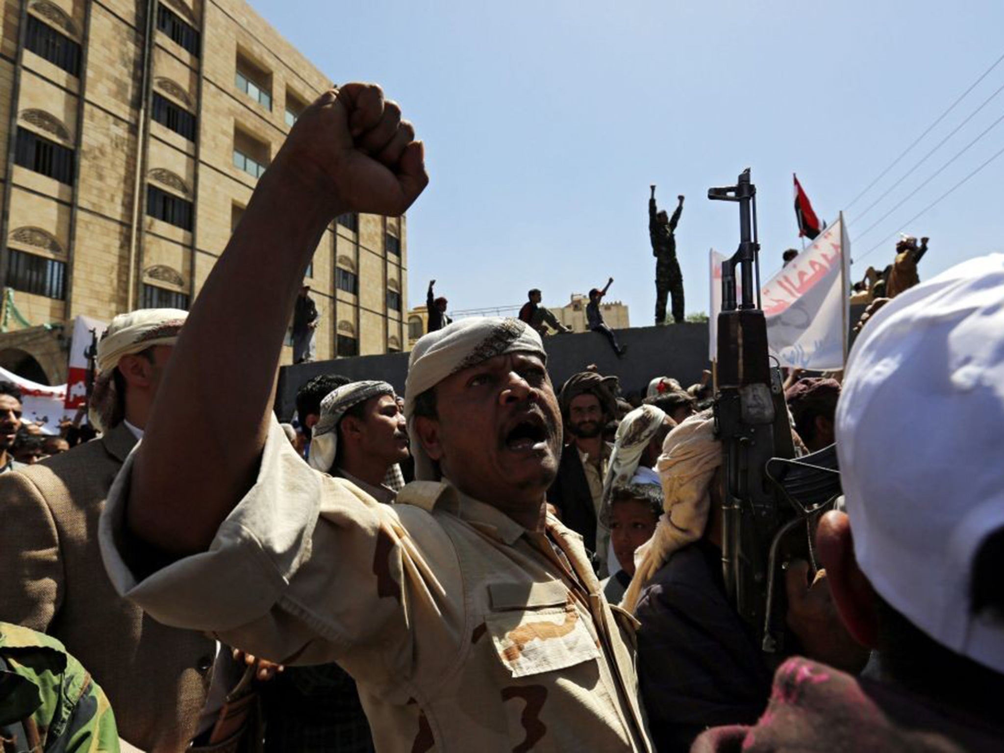 Yemenis shout anti-Saudi slogans outside the UN offices in Sana’a