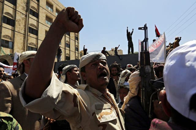 Yemenis shout anti-Saudi slogans outside the UN offices in Sana’a