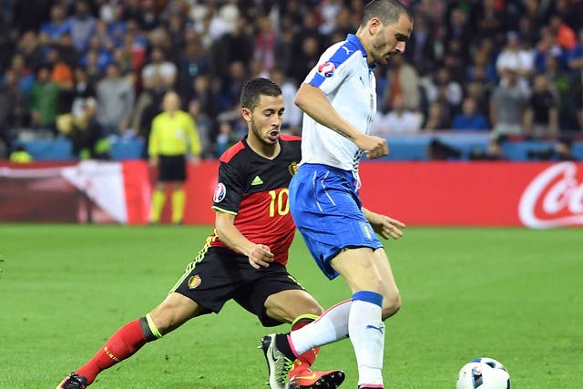 Eden Hazard and Leonardo Bonucci tussle for the ball while on international duty