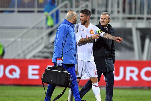 Sergio Ramos is led off the pitch after suffering an injury for Spain
