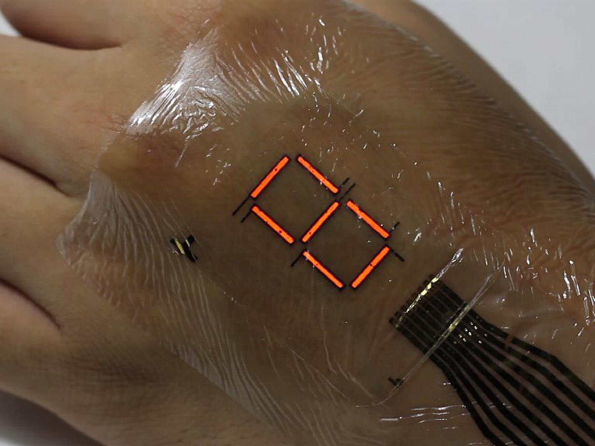 The ‘optoelectronic skin’ is an ultra-thin, flexible LED display that can be worn on the back of your hand